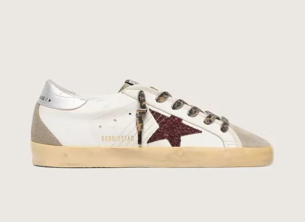 White women's sneaker with a burgundy star